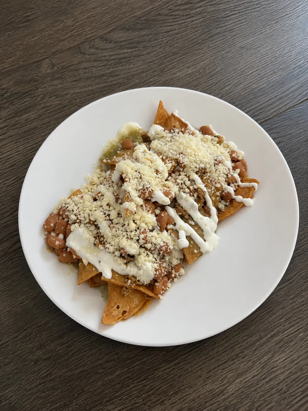 Chilaquiles — authentic Mexican breakfast with tortilla chips simmered in salsa, served at El Cafesito By Mexicanada in Edmonton
